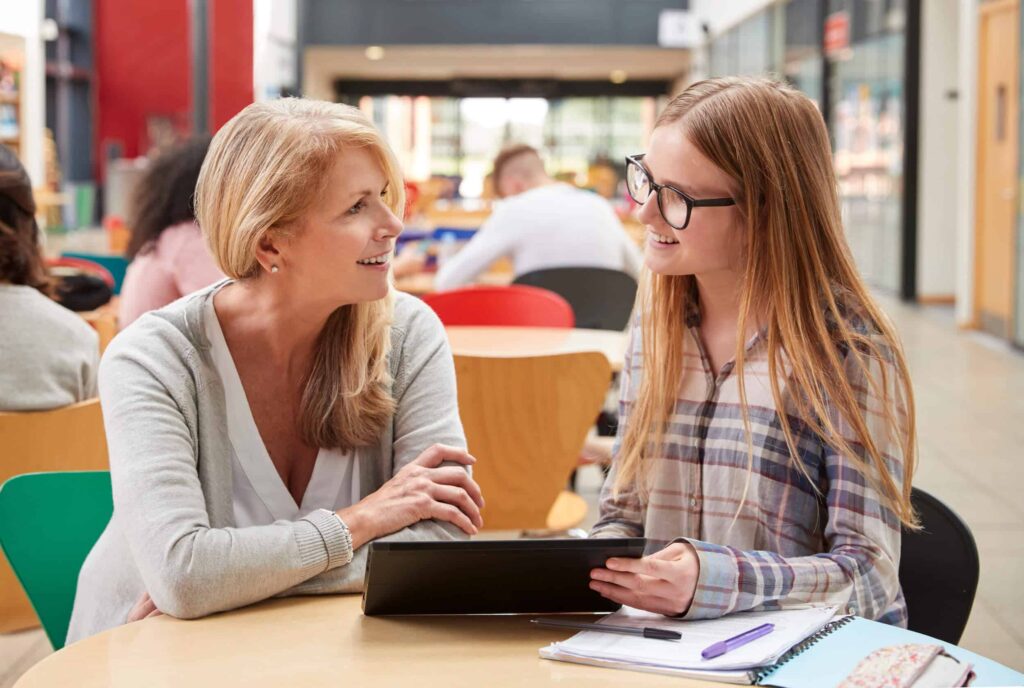 Teacher talking with student